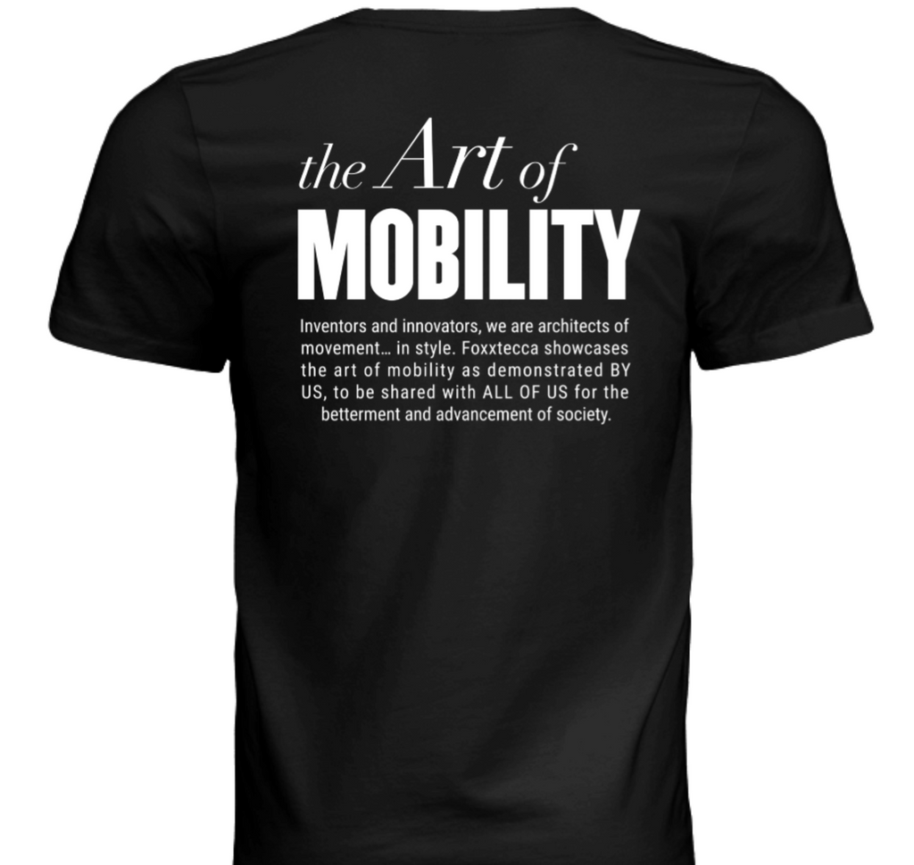 Back view of black t-shirt featuring the phrase “The Art of Mobility” in bold white lettering, followed by a mission statement highlighting Foxxtecca’s commitment to innovation, movement, and societal advancement.
