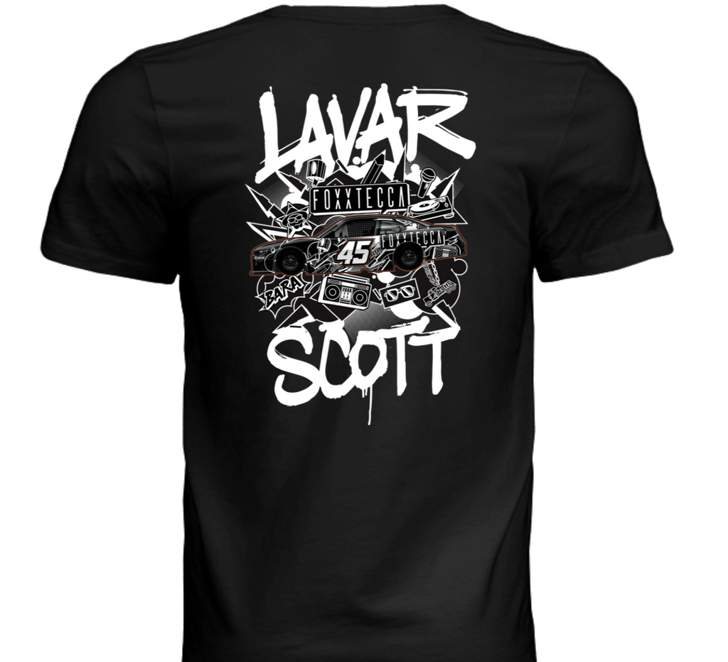 Black graphic t-shirt back view with large graffiti-style “LAVAR SCOTT” text, Foxxtecca branding, and NASCAR Xfinity No. 45 race car illustration surrounded by hip-hop culture icons including boombox, chains, and sunglasses. Exclusive Lavar Scott motorsport streetwear by Foxxtecca.